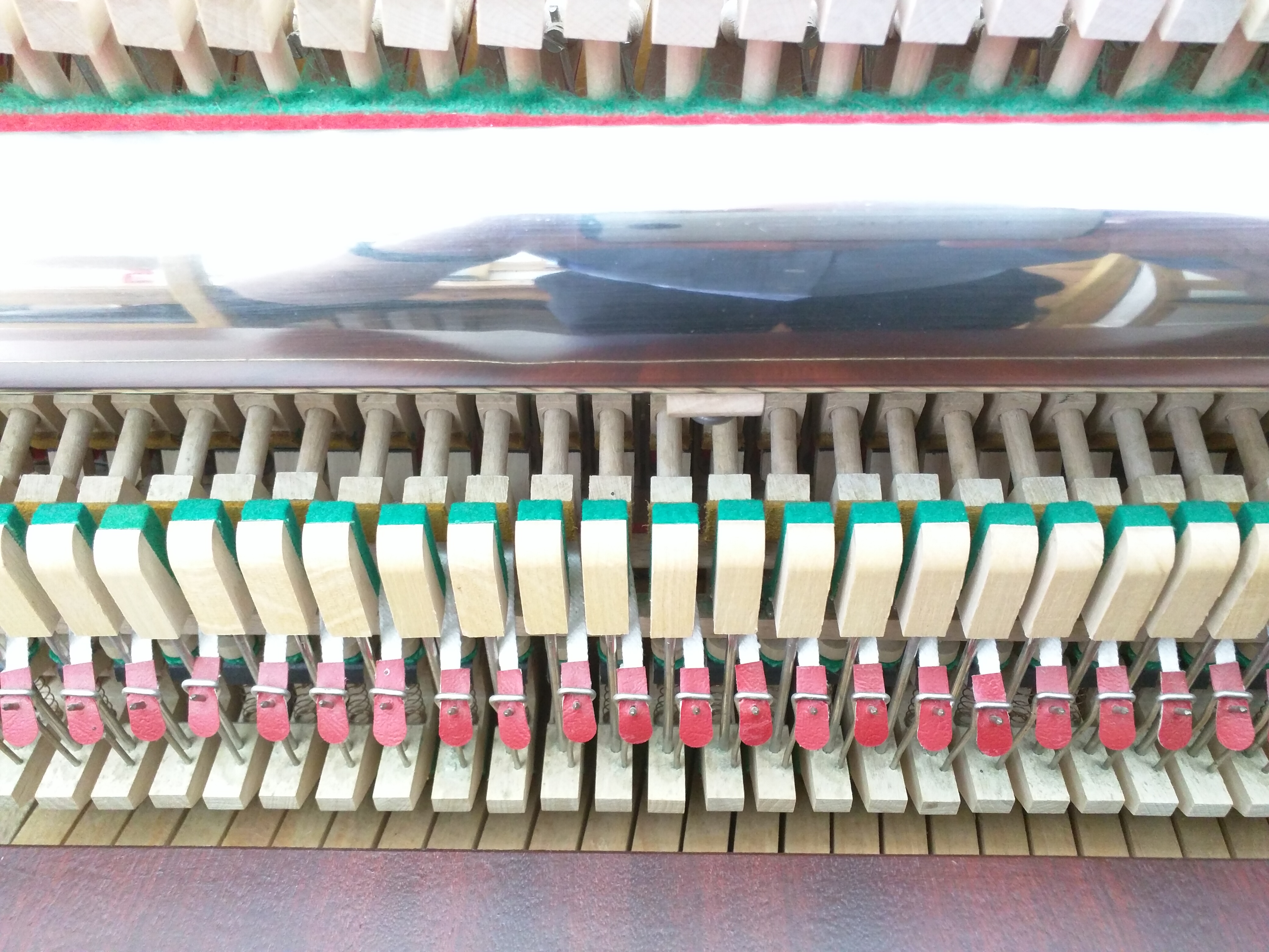 Close up of Piano Action on Scholze Upright Piano - bridal tapes and check heads