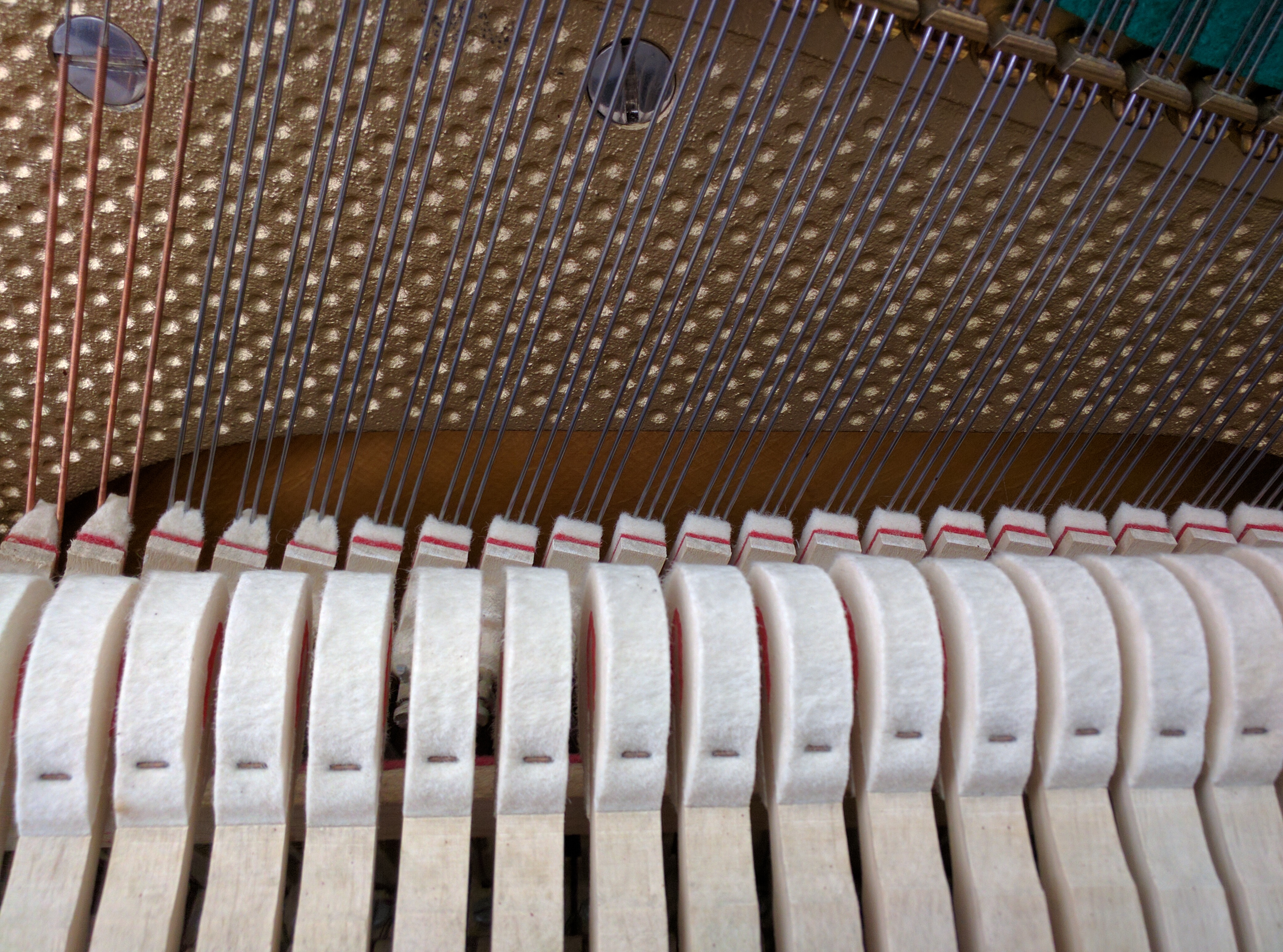 Close view of Piano Hammers and dampers (regulated) on Scholze Upright Piano