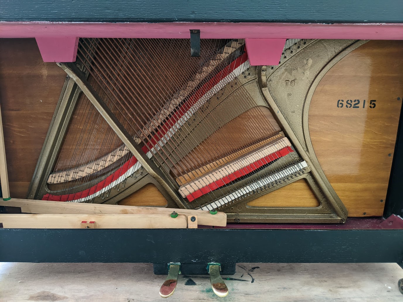 Close up of trap work and pedals on the Barratt & Robinson Upright Piano