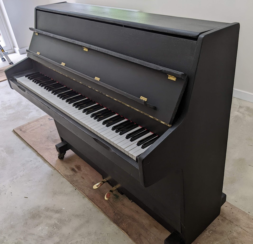 Side view of Barratt & Robinson Upright Piano